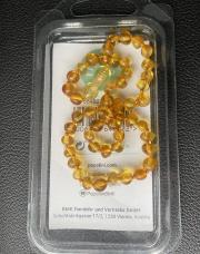 Collier popolonie ambre rond neuf apporte un confort sur les pousses dentaires 
