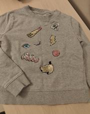 Pull gris avec écusson à paillettes 6 à 7ans 