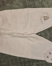 Pantalon rose pâle avec pieds 