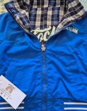 Fin manteau réversible bleu 12m