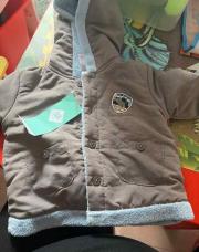 Manteau neuf taille 74