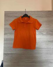 Polo orange 7 ans 