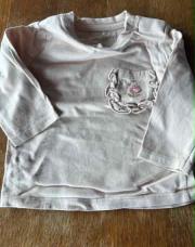Blouse kiabi 6 mois avec une poche fleur