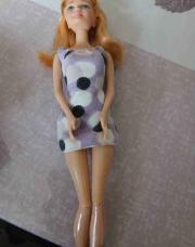 Poupee mauve rond