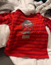 Pull 6 mois rouge ligne avec motif moustache 
