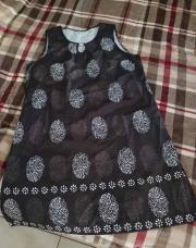 Robe sans manche noir et blanche avec anneau taille L
