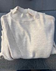 Pull beige cache cœur 